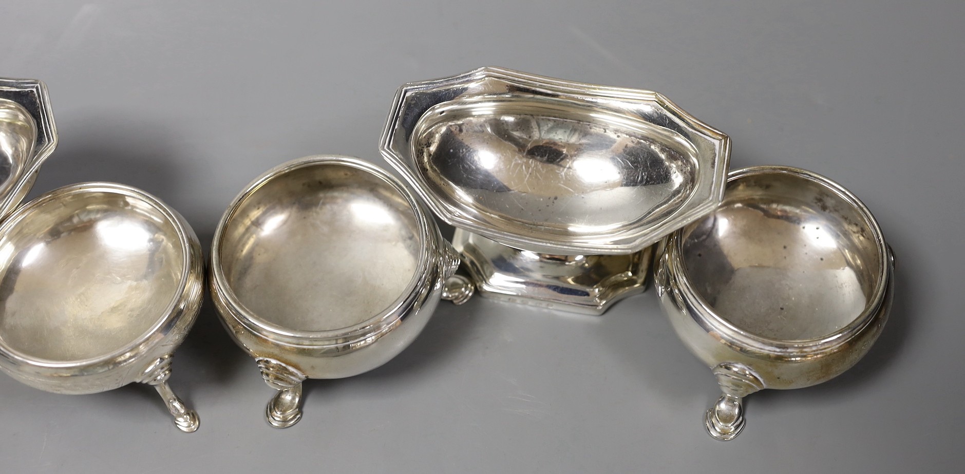 A pair of George III silver boat shaped pedestal salts, Abstinando King, London, 1800, 92mm and four other assorted silver salts.